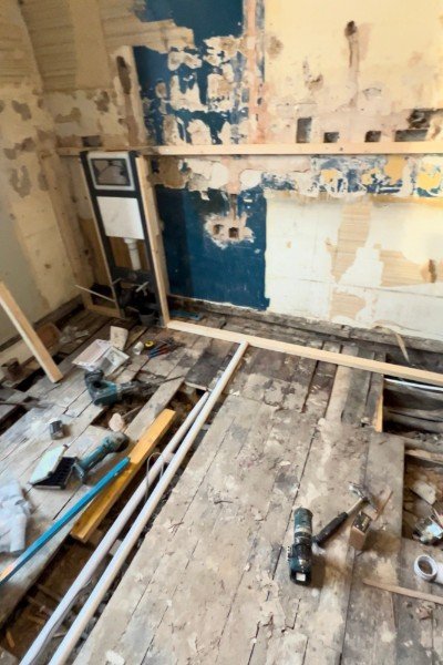 Existing soil pipe beneath the floor with new WC branch connection, kitchen to bathroom conversion, Edinburgh