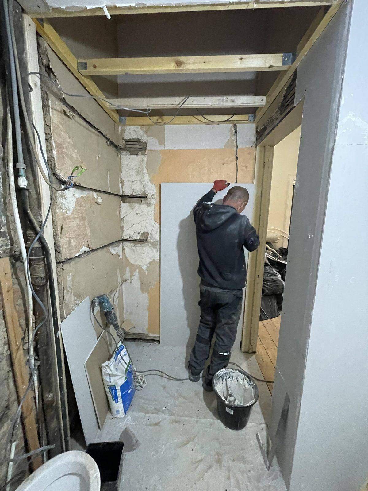 Non-loadbearing wall removed between bathroom and cupboard during a flat renovation, Edinburgh