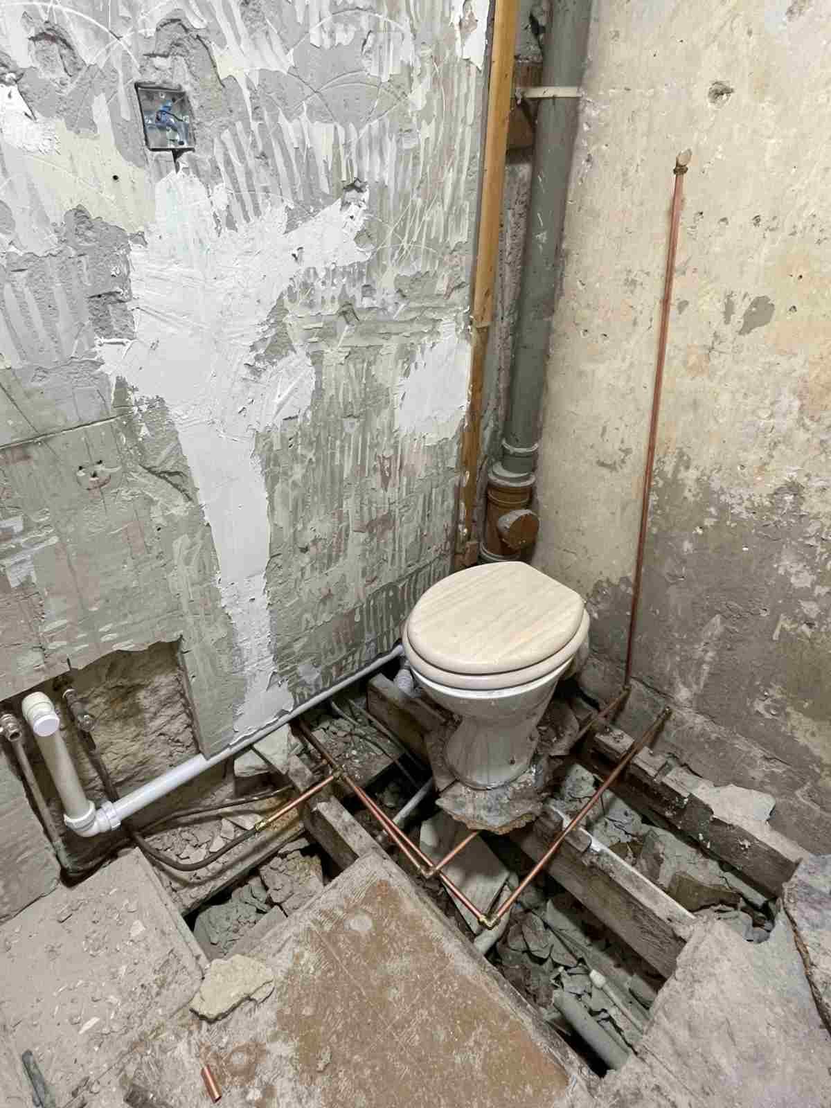 Water-damaged bathroom floor found during strip-out, Stockbridge flat